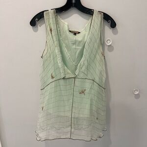 Green Sleeveless Blouse with V-Neckline